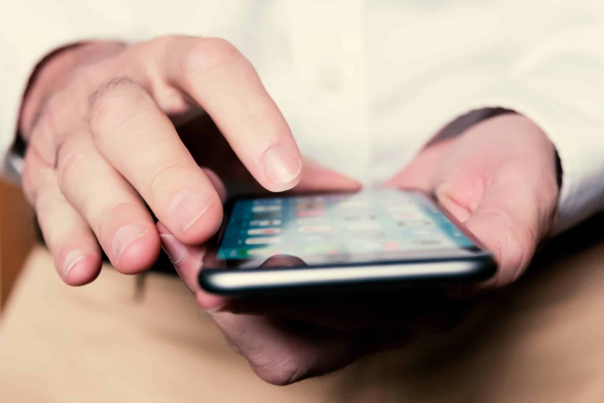 Person using apps on their phone