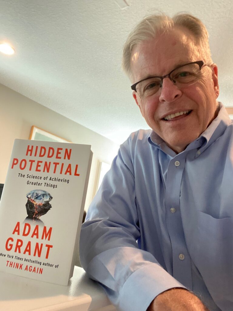 Blaine with Adam Grant's book